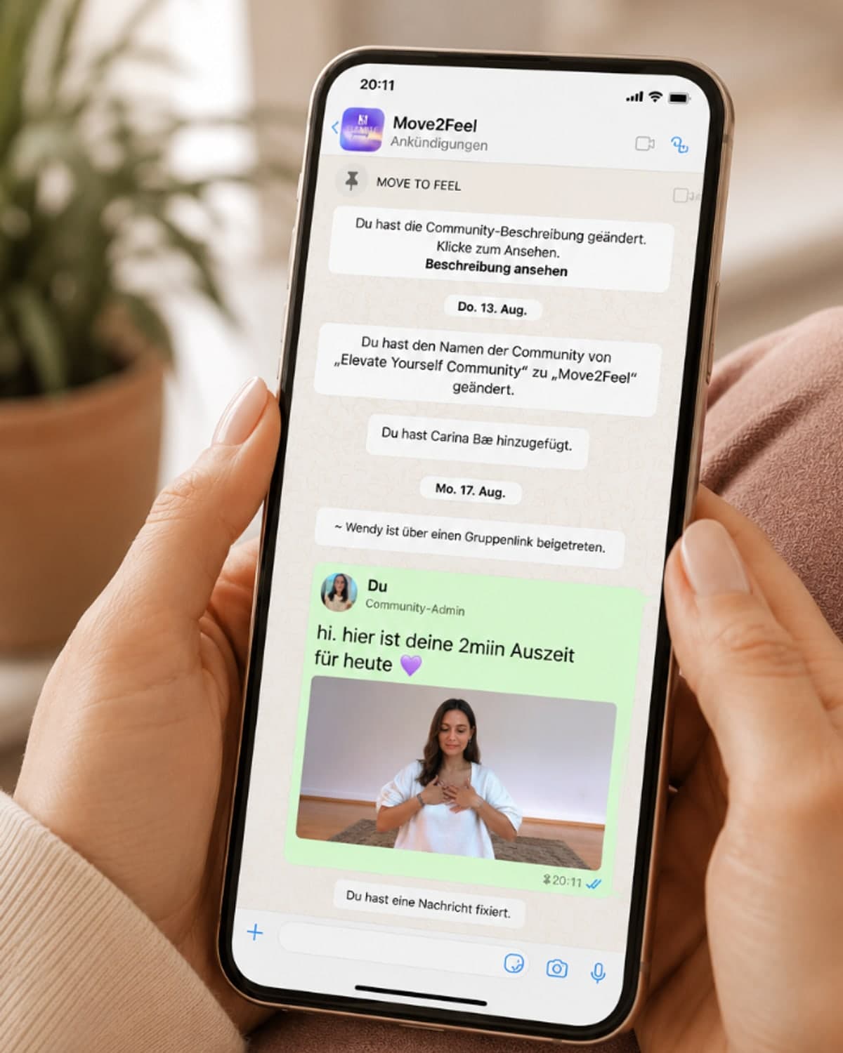 Phone showing the Move2Feel WhatsApp community and a two-minute break